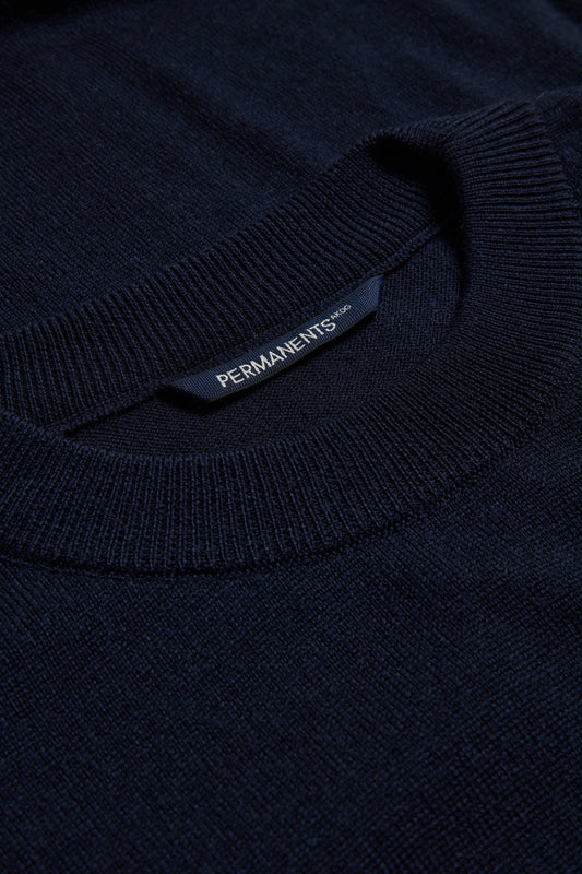 Unisex knit crewneck, 100% mulesing-free merino wool, navy, with rib-knit neck and PERMANENTS® label.
