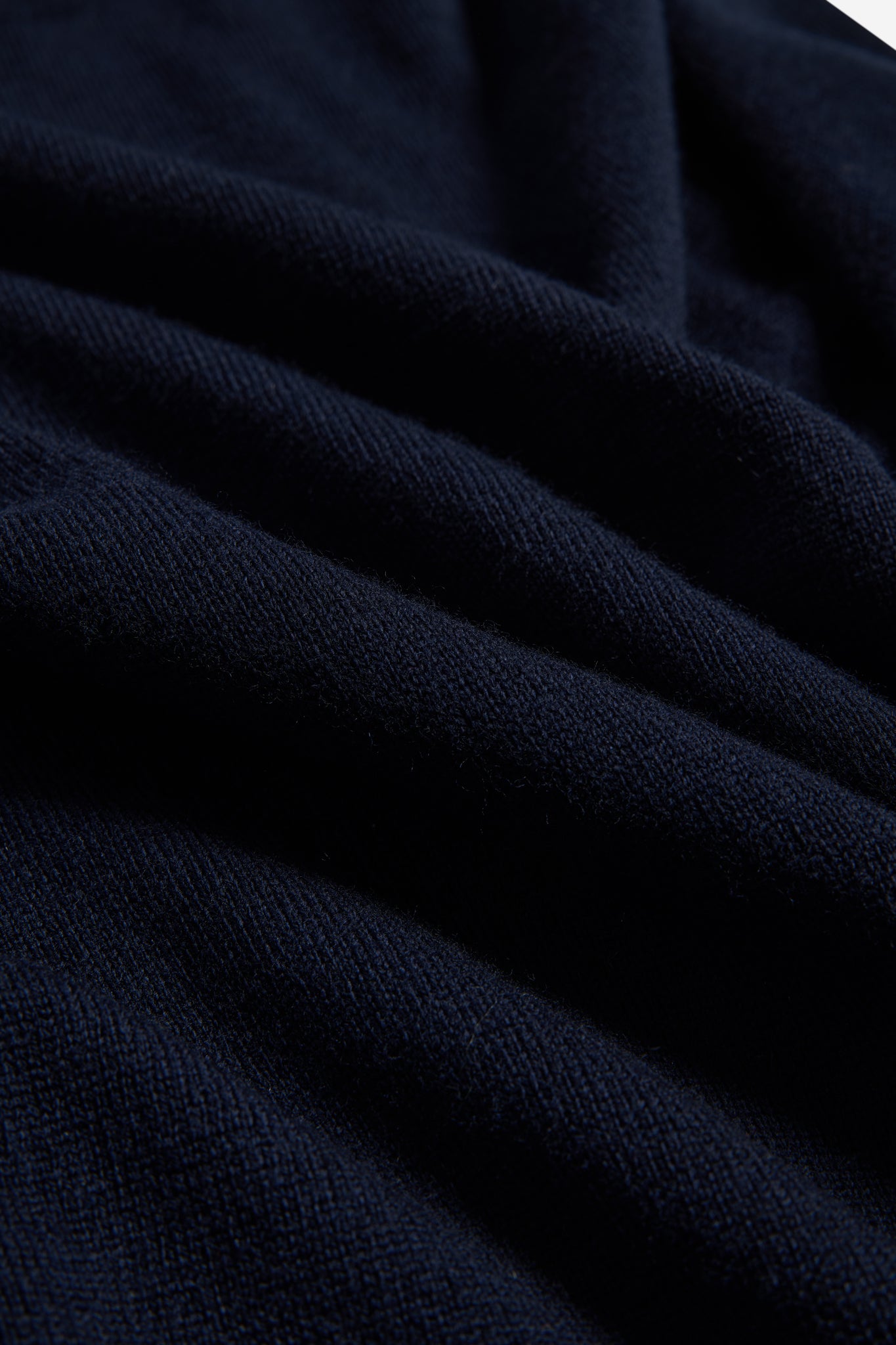 Unisex knit crewneck, navy mulesing-free merino wool with rib-knit details.