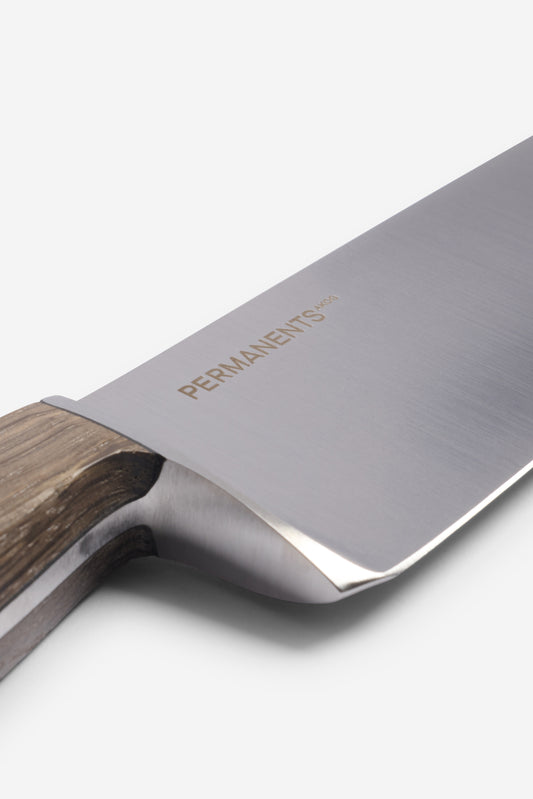 Chef's knife with a brushed steel blade and a light gray to deep black Bavarian Bog Oak handle.