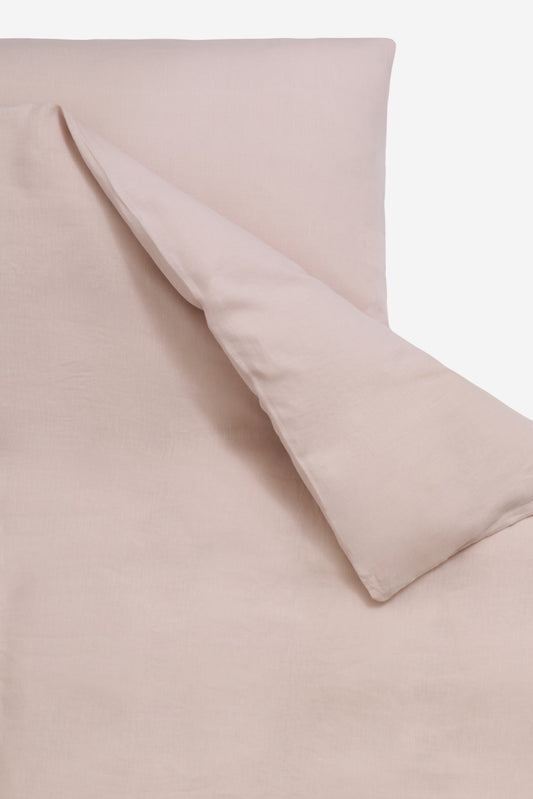 Duvet cover, organic cotton, apple blossom, 140x200cm, with subtle texture and folded corner.