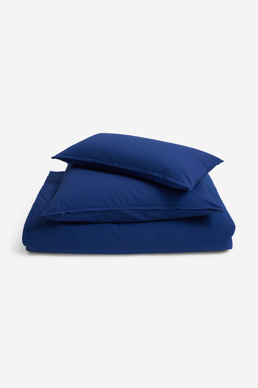 Duvet cover set, 100% organic cotton seersucker, blue hour, with zipper closure.