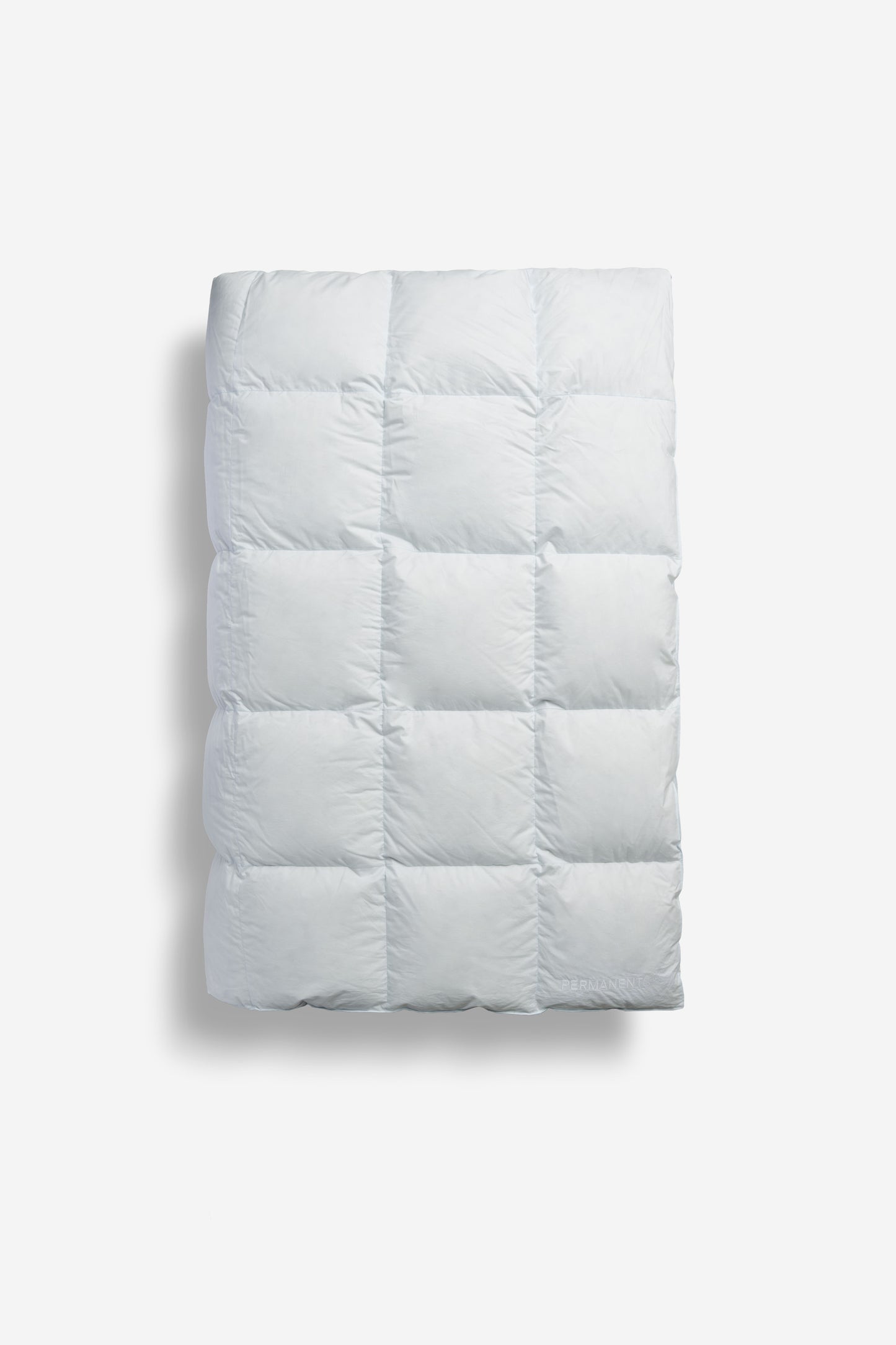 White cotton eiderdown duvet, 135x200cm, with a quilted design and subtle PERMANENTS® branding.