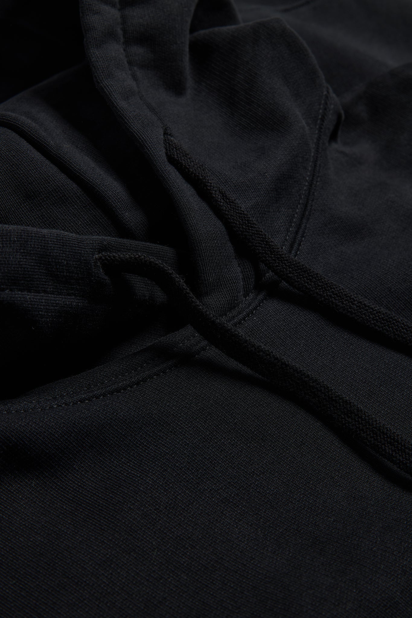 Men's/Women's jersey hoodie, black organic cotton, pre-washed, with adjustable hood and drawstrings.