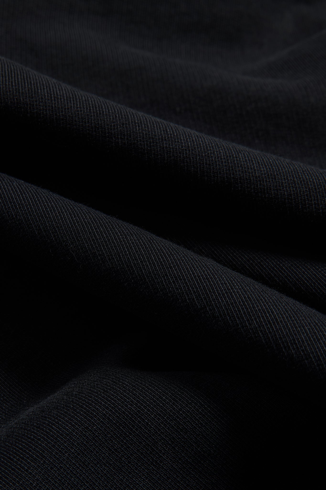 Men's/Women's jersey hoodie, 100% organic cotton, pre-washed black heavy jersey fabric with subtle texture.