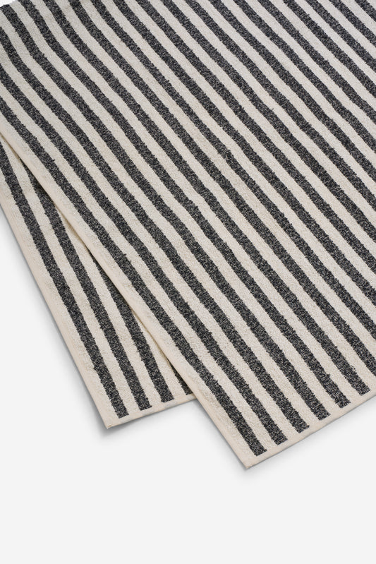 Linen towel, 80x160cm, with wide indigo stripes on a natural background, made from 68% linen and 32% cotton.