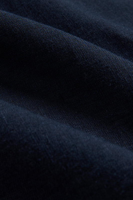 Accessories napkin, 100% Belgian linen, midnight navy, showing soft folds of fabric.