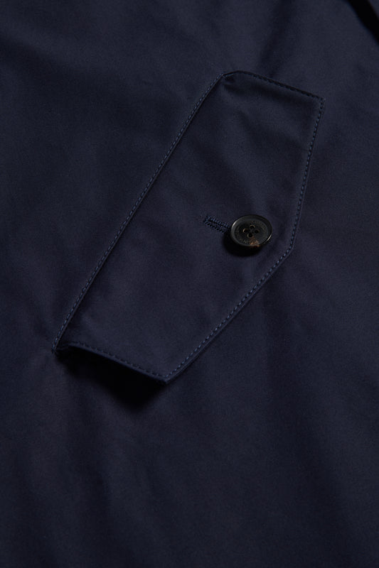 Men's outerwear parka, navy organic cotton EtaProof® fabric, close-up of flap pocket with button.