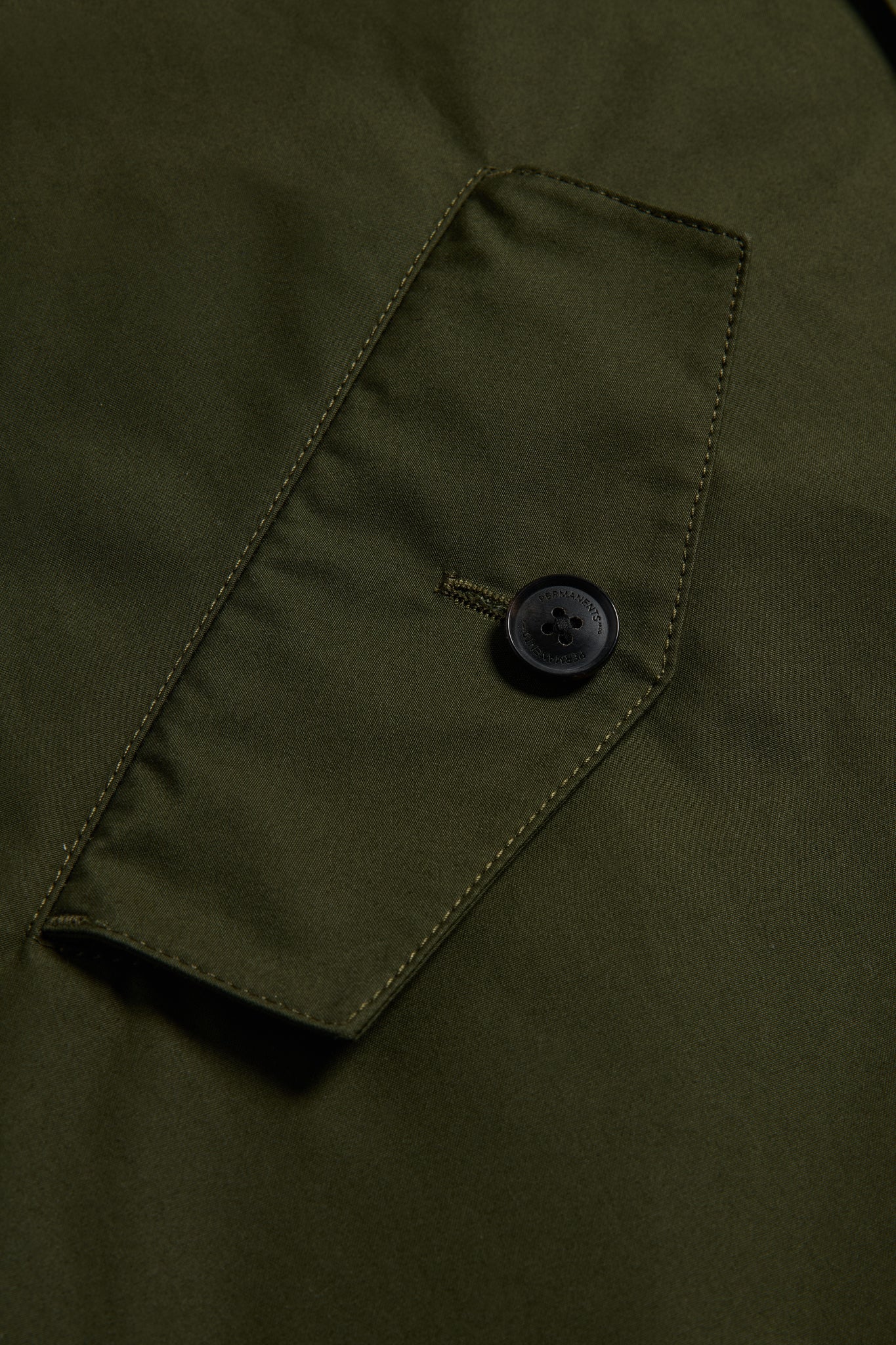 Men's outerwear parka, organic cotton, olive, with a flap pocket and black button.