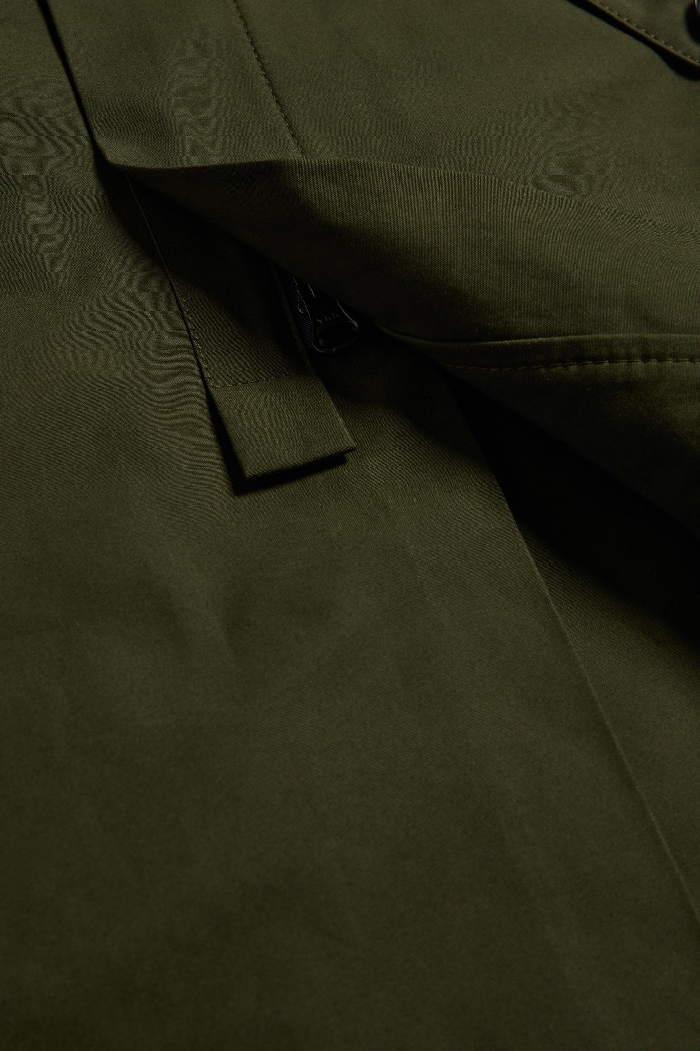 Unisex outerwear parka, organic cotton EtaProof® fabric, olive, with flap pocket and zipper detail.