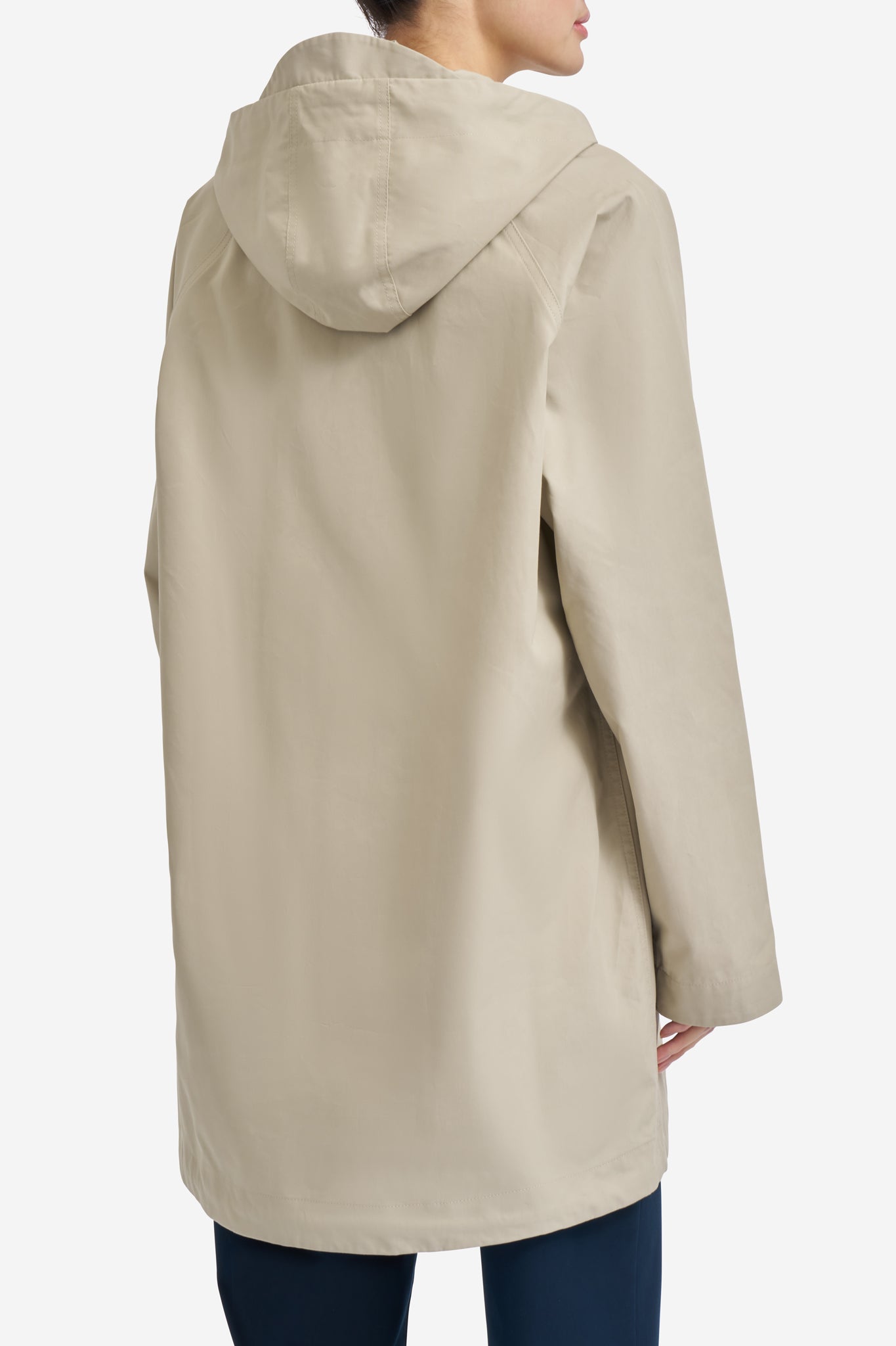 Women's outerwear parka, organic cotton, stone, with adjustable hood and flap pockets.