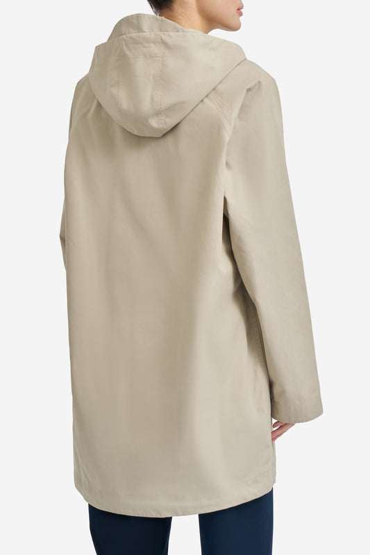 Women's outerwear parka, organic cotton, stone, with adjustable hood and flap pockets.