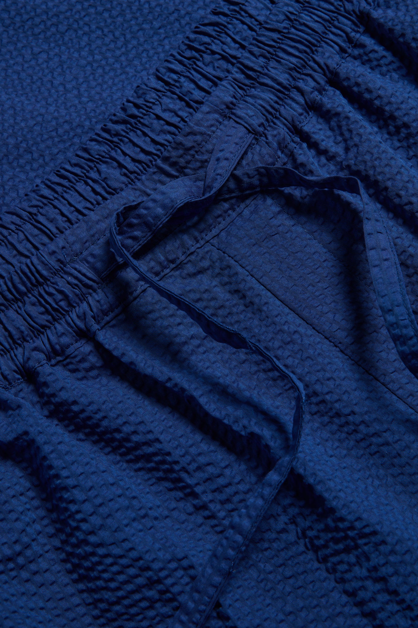 Unisex pyjama pants, organic cotton seersucker, blue hour, with elasticated drawstring waist.
