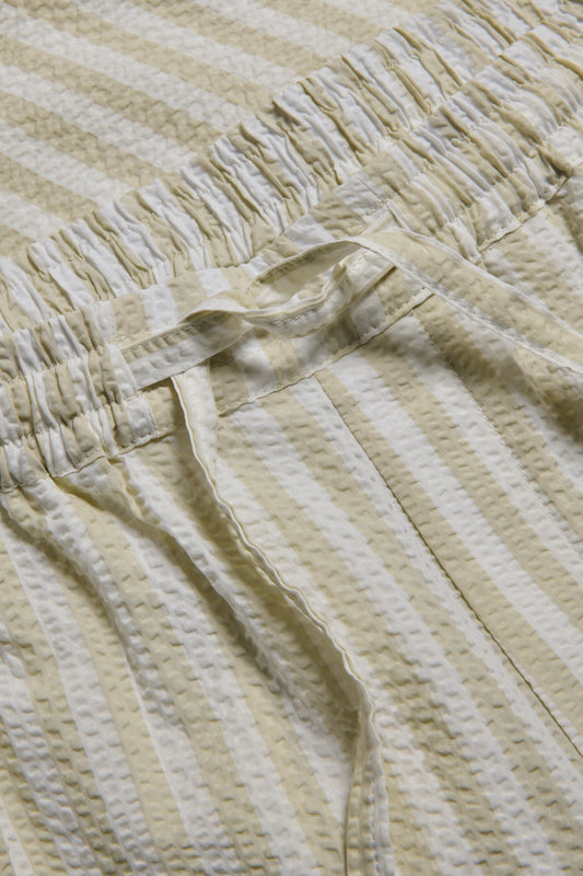 Unisex long-pants, 100% organic cotton seersucker, sage stripe, with elasticated waist and drawstring.