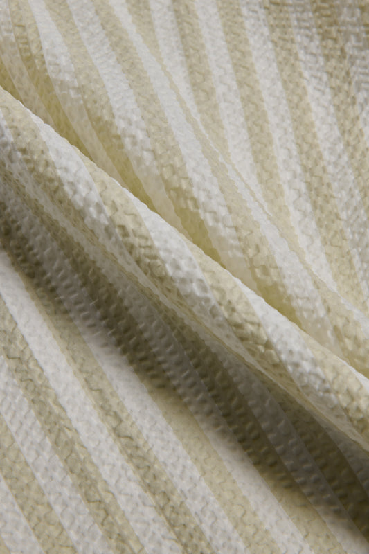 Unisex pyjama set, 100% organic cotton seersucker, sage stripe, close-up of fabric texture.