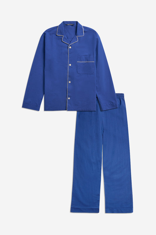 Unisex long-sleeved shirt and long-pants pyjama set, 100% organic cotton seersucker, blue hour, with piped trim.