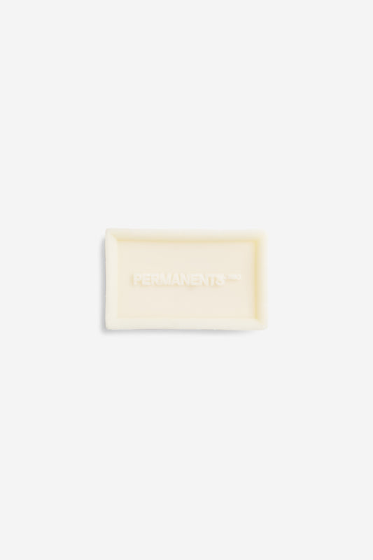 Accessories, soap bar, organic ingredients, off-white, rectangular, "PERMANENTS" embossed.
