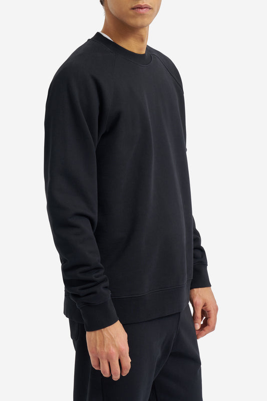 Men's knit long-sleeved sweater, 100% organic cotton, pre-washed, black, with raglan sleeves.