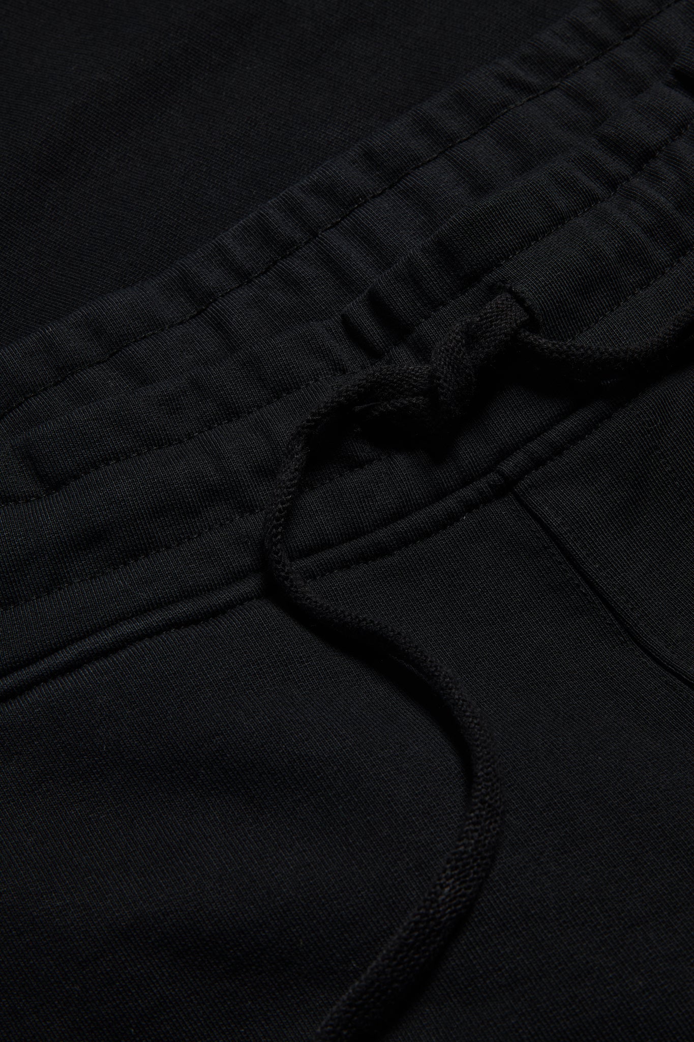Unisex long-pants, organic cotton heavy jersey, black, with elastic waistband and drawstring.