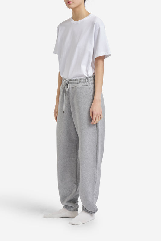Women's long-pants, organic cotton jersey, grey melange, with elastic waistband and drawstring.