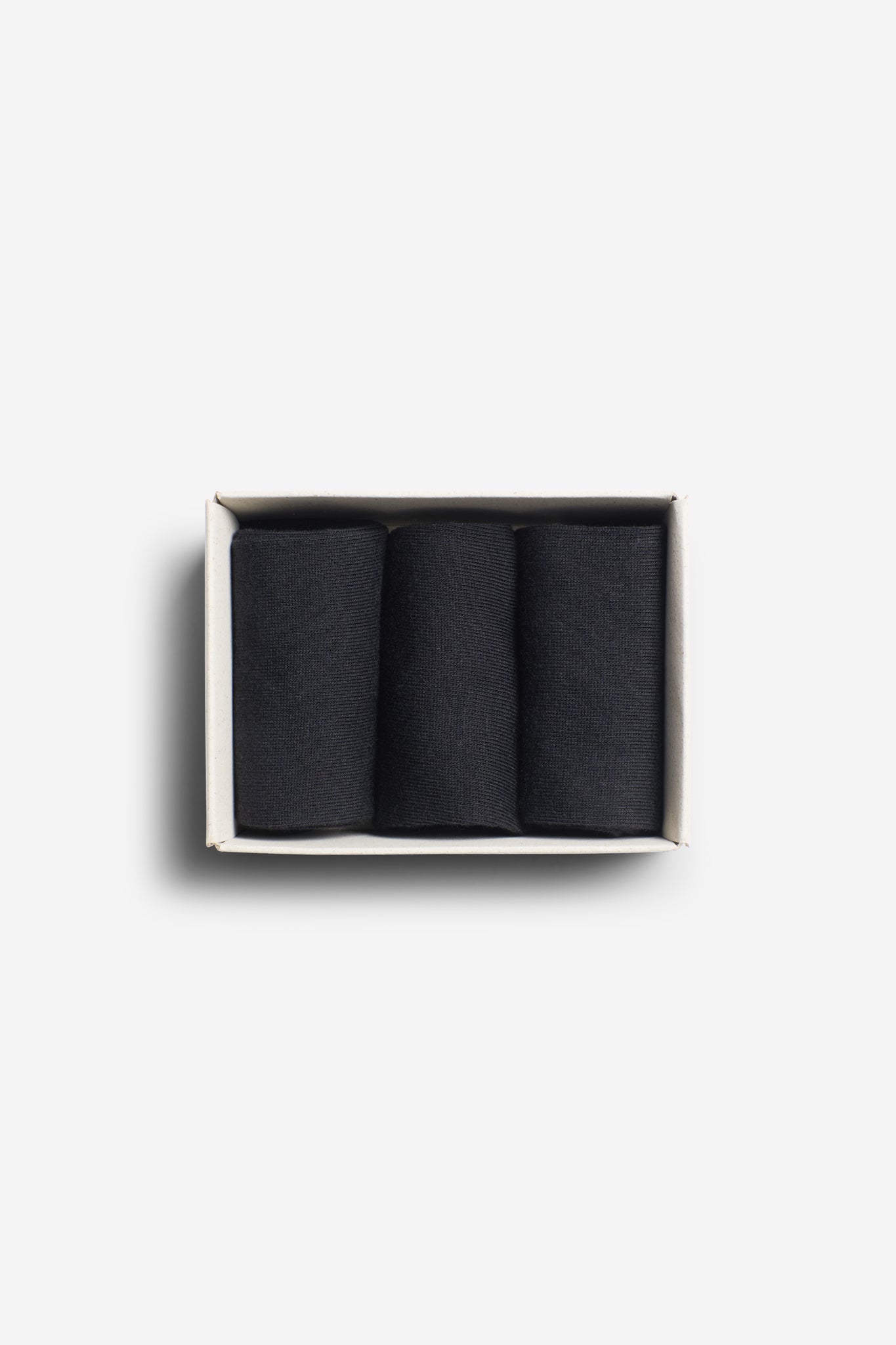 Unisex accessories socks, cotton mix, black, pack of three rolled in a white box.