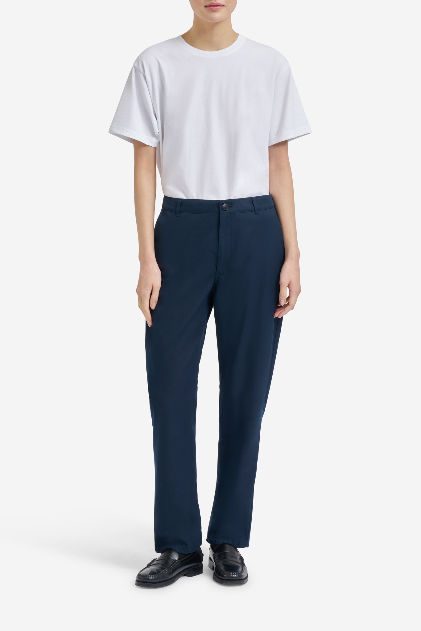 Women's long-pants, organic cotton twill, washed navy, with flat front and button-up back pockets.