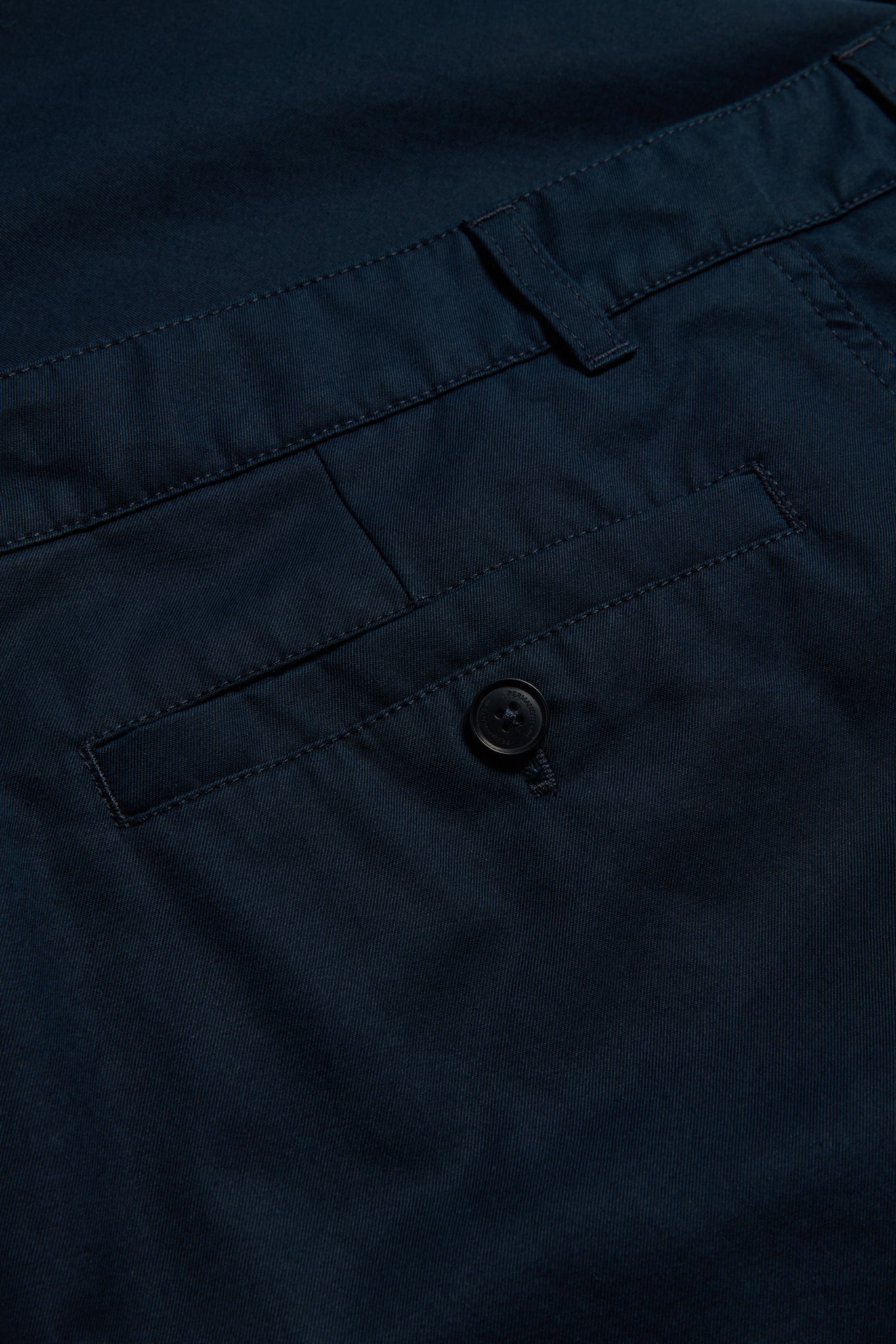 Men's long-pants, organic cotton twill, washed navy, with button-up box back pocket.