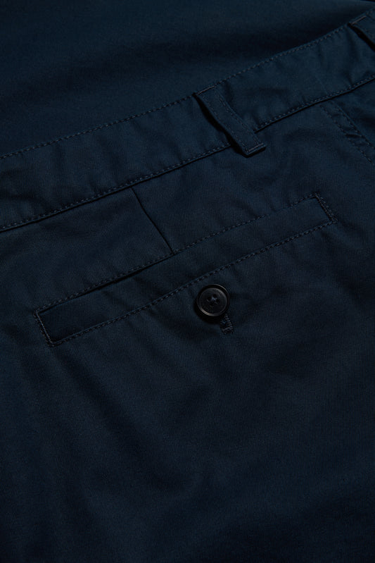 Men's long-pants, organic cotton twill, washed navy, with button-up box back pocket.