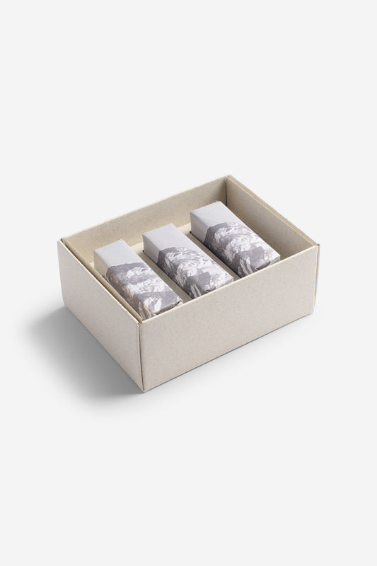 Accessories set of 3 soap bars, individually wrapped in grey and white patterned paper, in a natural cardboard box.