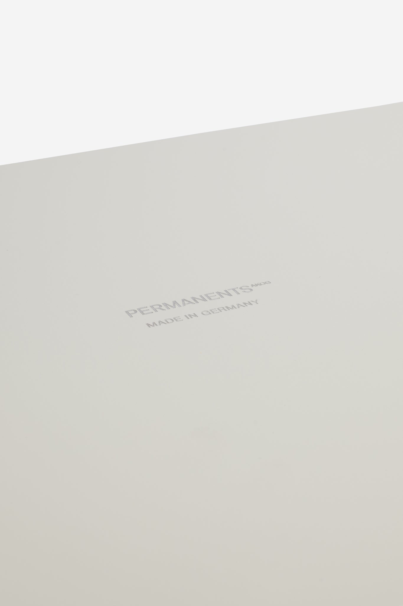 Accessories tray, small, white coated aluminum, with "PERMANENTS MADE IN GERMANY" text.