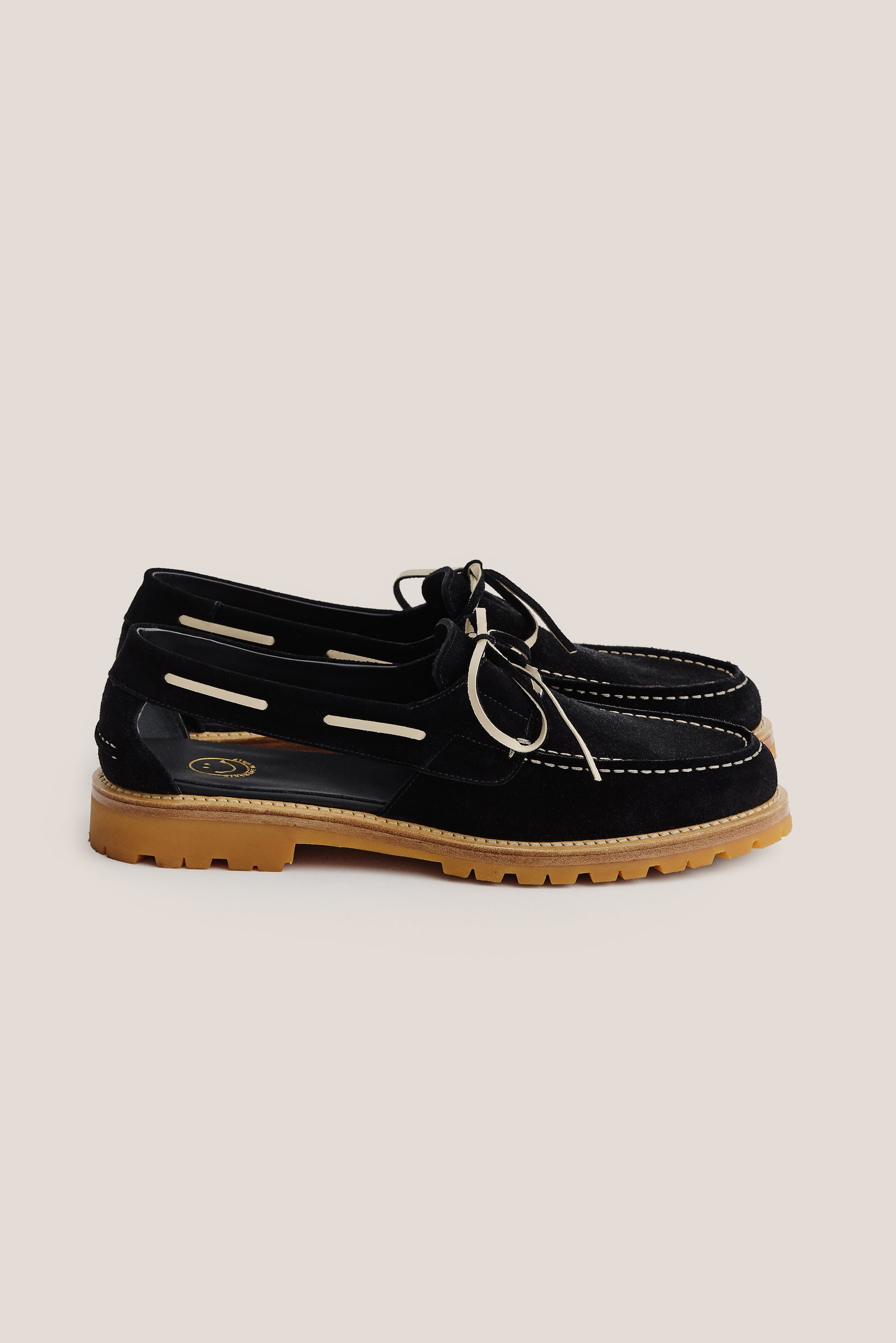 Men's accessories sandal, black Italian vegetal cowhide, boat-style, slingback, white laces, and tan lug sole.