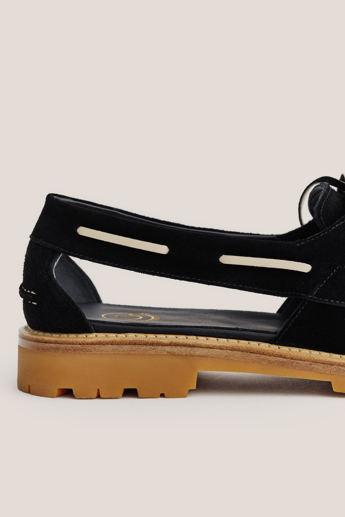 Women's accessories sandal, black Italian vegetal cowhide, boat-style slingback with tan lug sole.