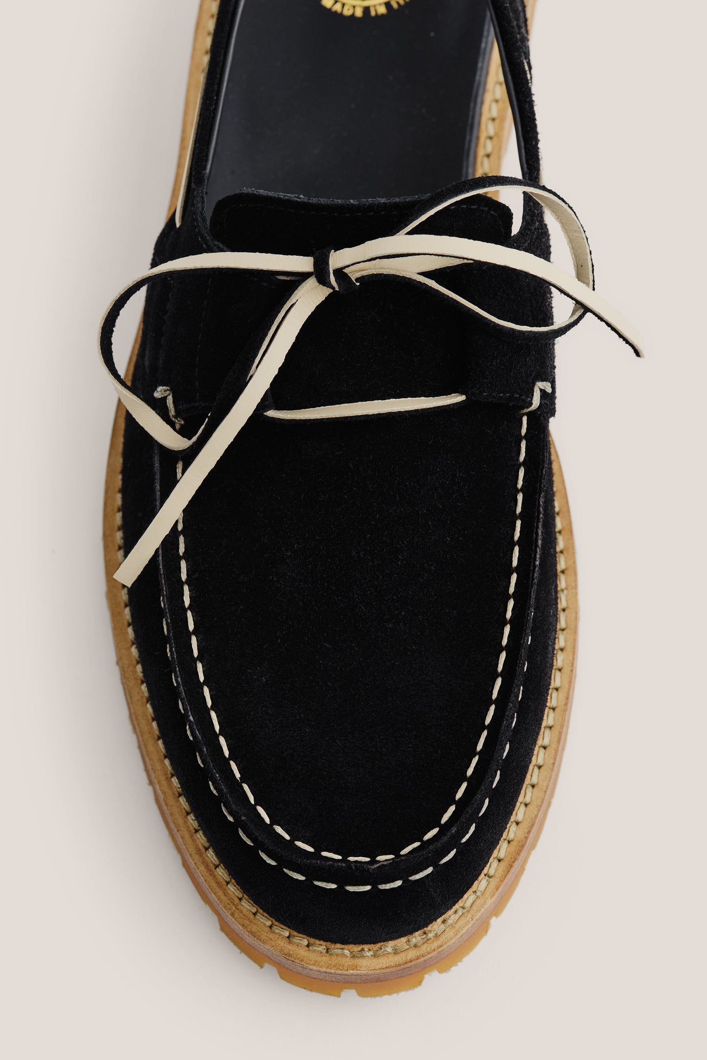Men's accessories sandal, black Italian vegetal cowhide, boat-style with white lacing and stitching.