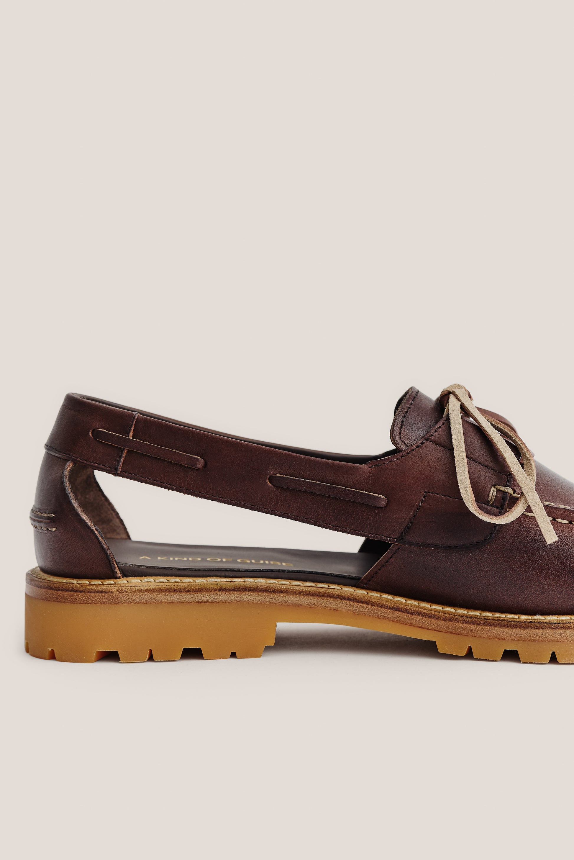 Women's accessories sandal, brown Italian vegetal cowhide, boat-style slingback with natural laces and lug sole.