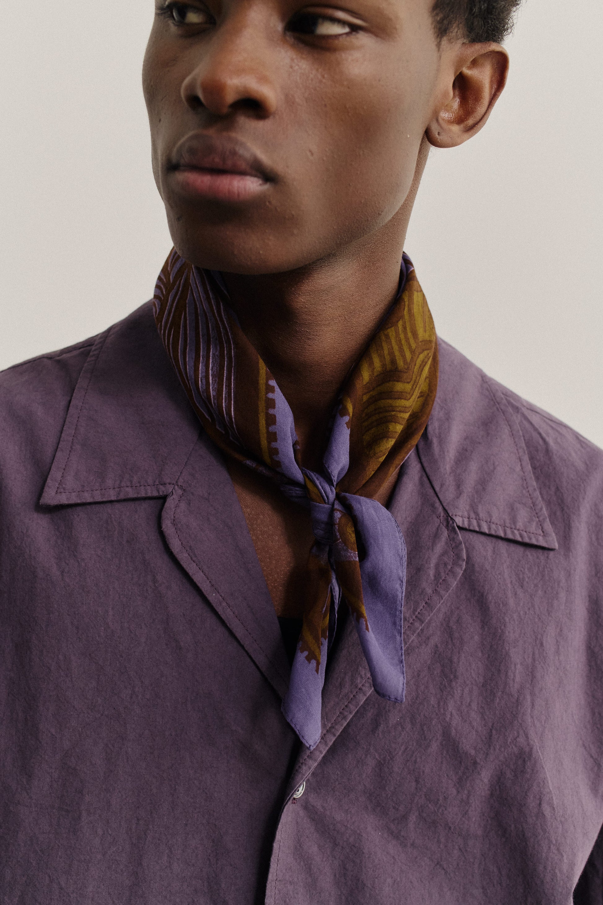 Men's accessories cotton bandana with brown and purple African wildlife print.