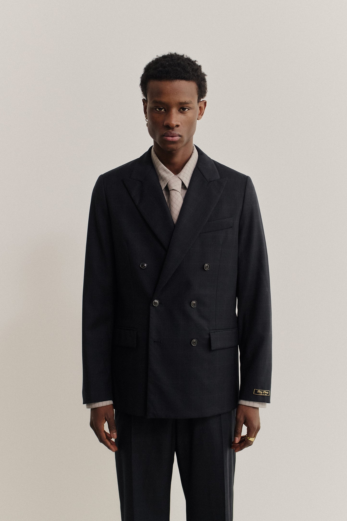 Men's tailoring, double-breasted peak blazer in checkered black virgin wool, size 48.