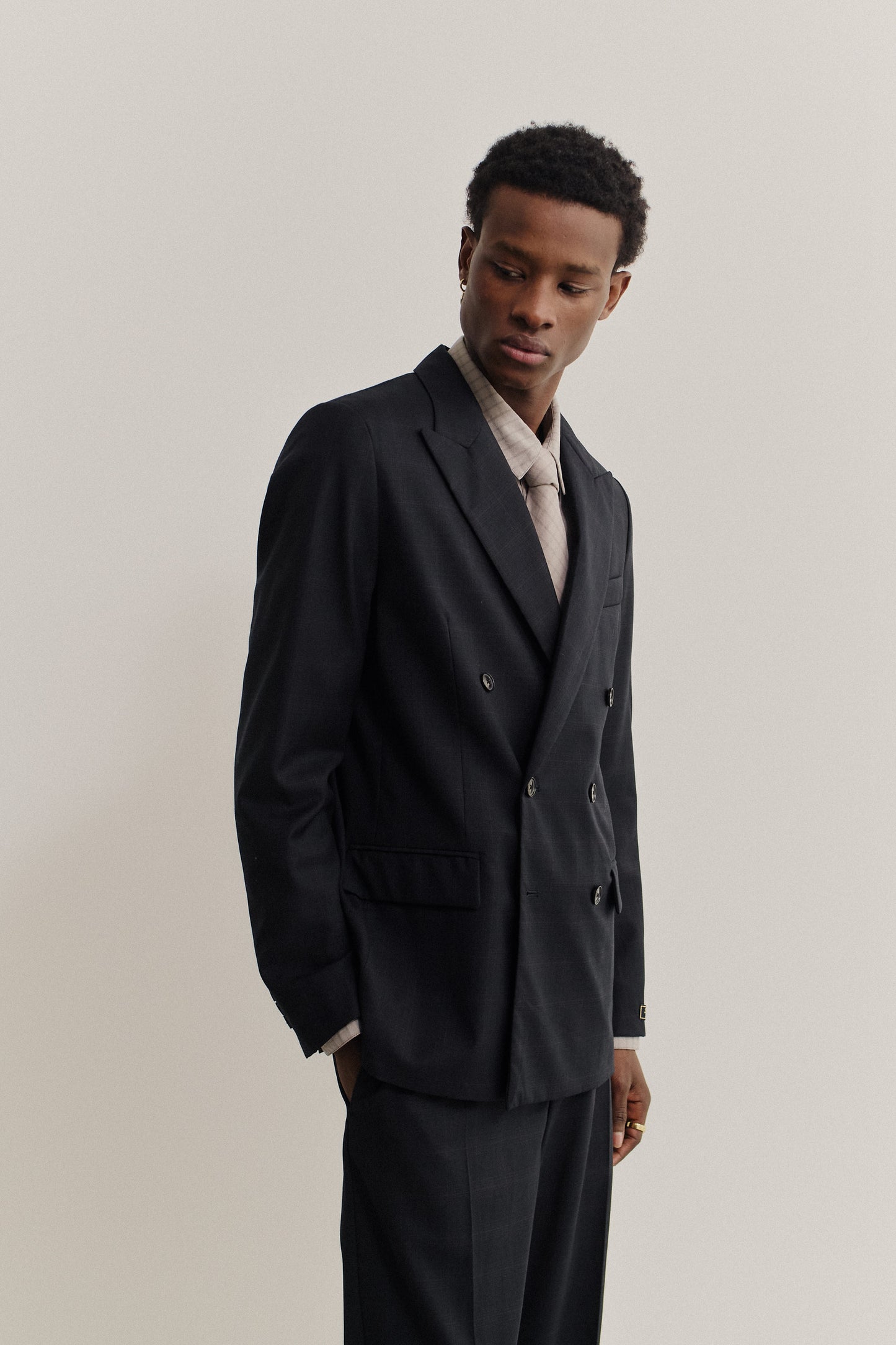 Men's tailoring, double-breasted peak blazer, 100% virgin wool, checkered black, relaxed fit.