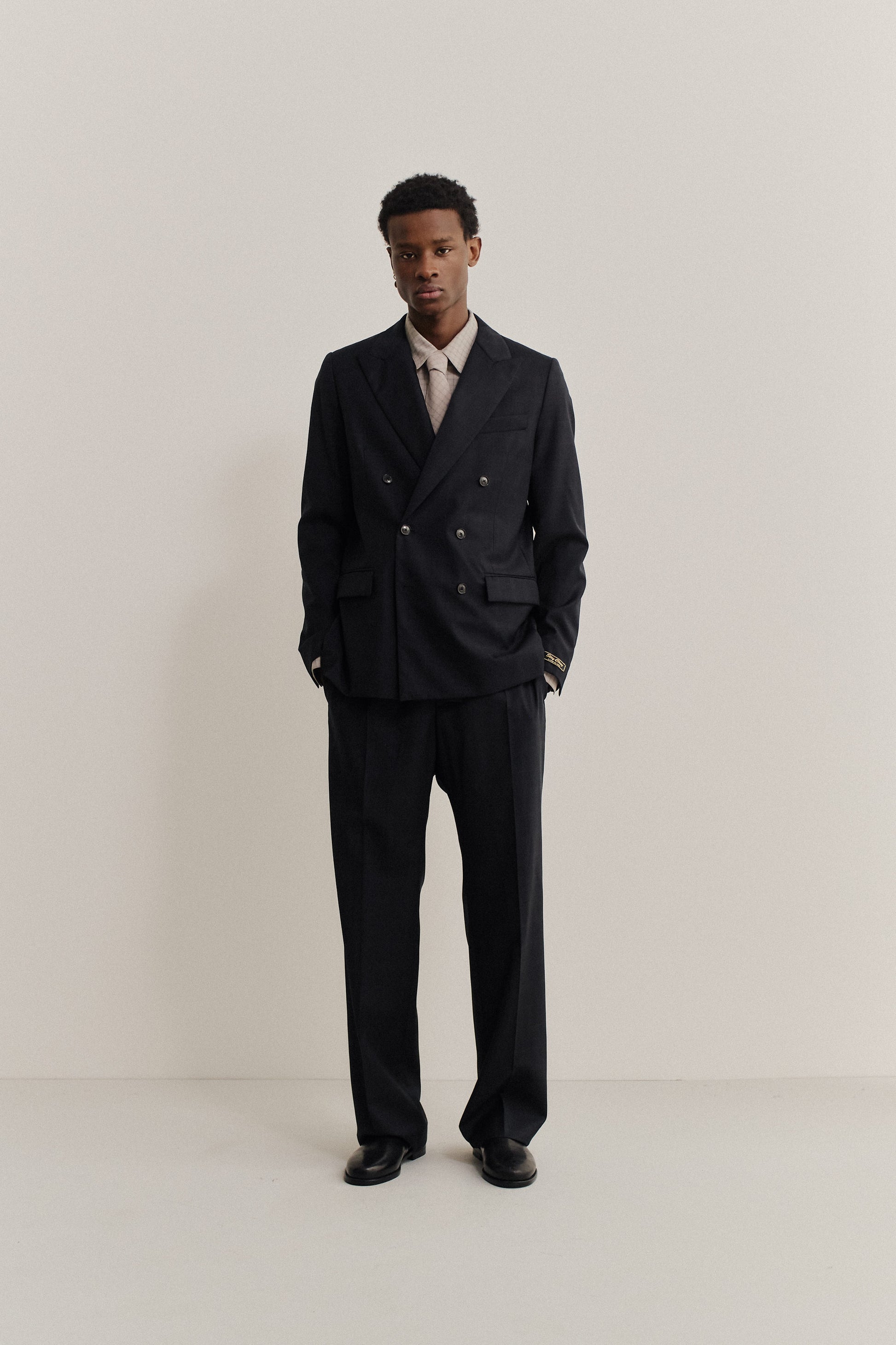 Men's tailoring, double-breasted peak blazer and trousers, 100% virgin wool, checkered black.