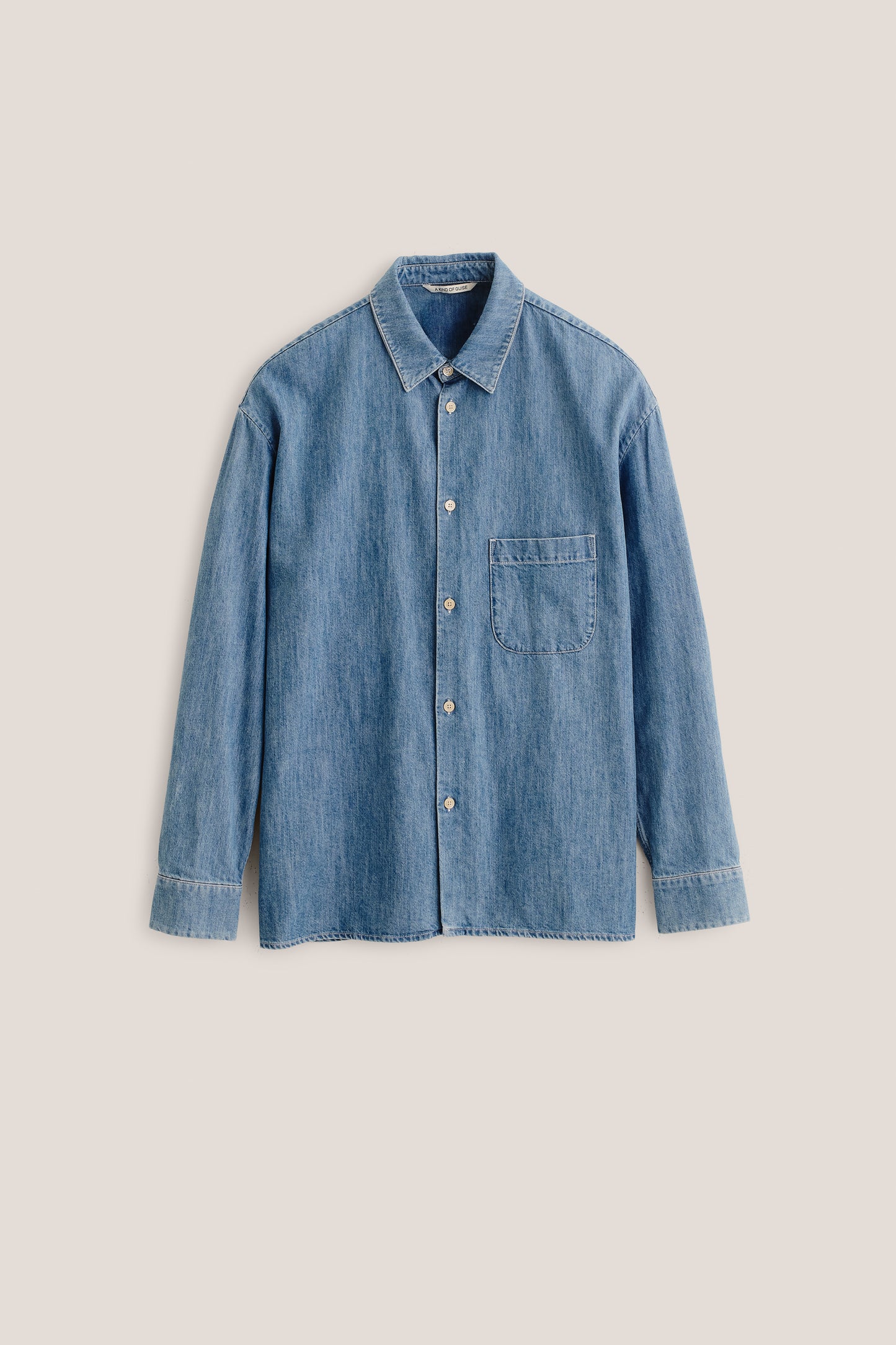 Men's long-sleeved shirt, light blue denim cotton-silk mix, oversized with patch pocket.