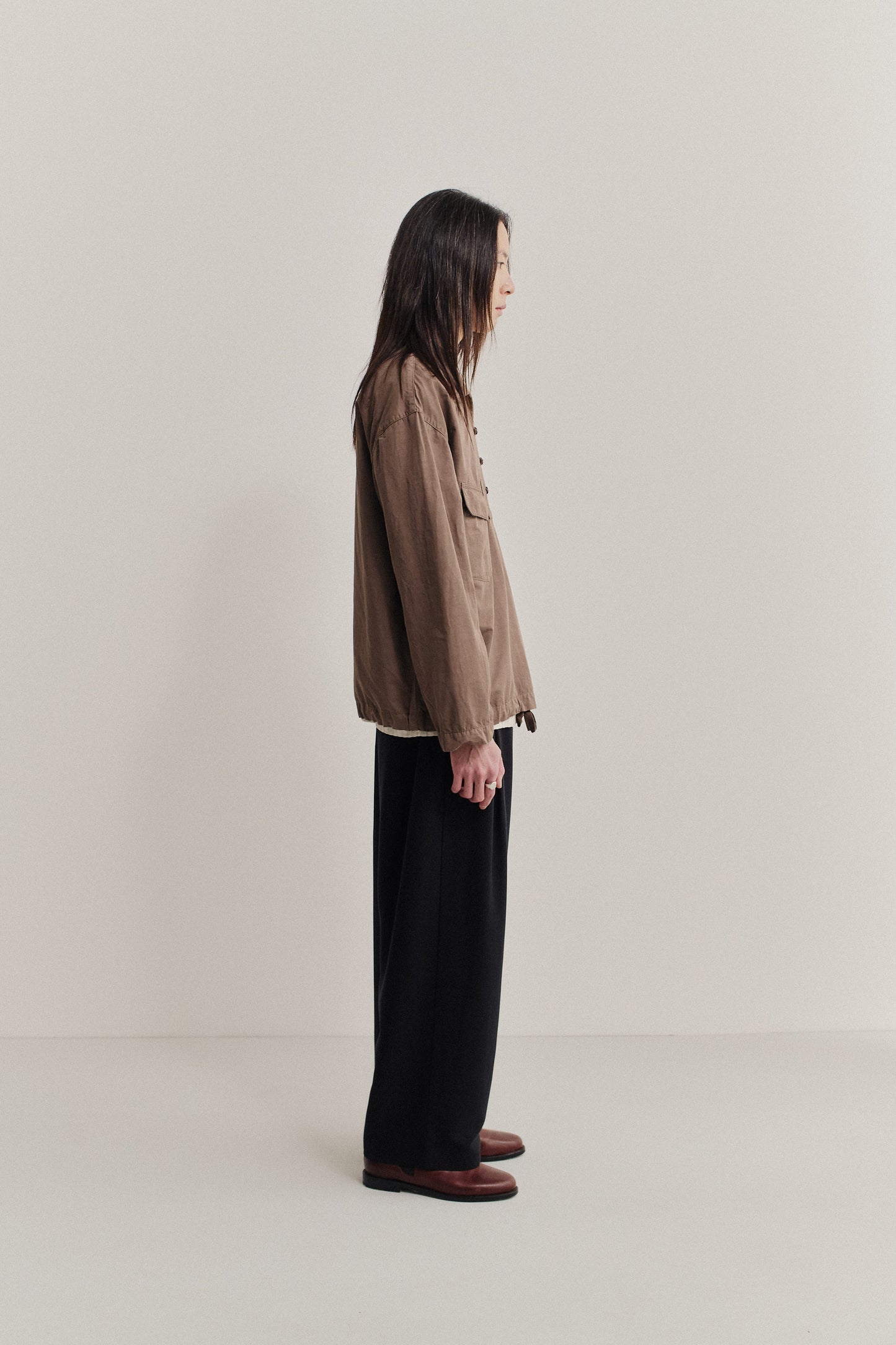 Men's long-sleeved shirt jacket, cotton-linen blend, garment dyed brown, with patch pockets and spread collar.