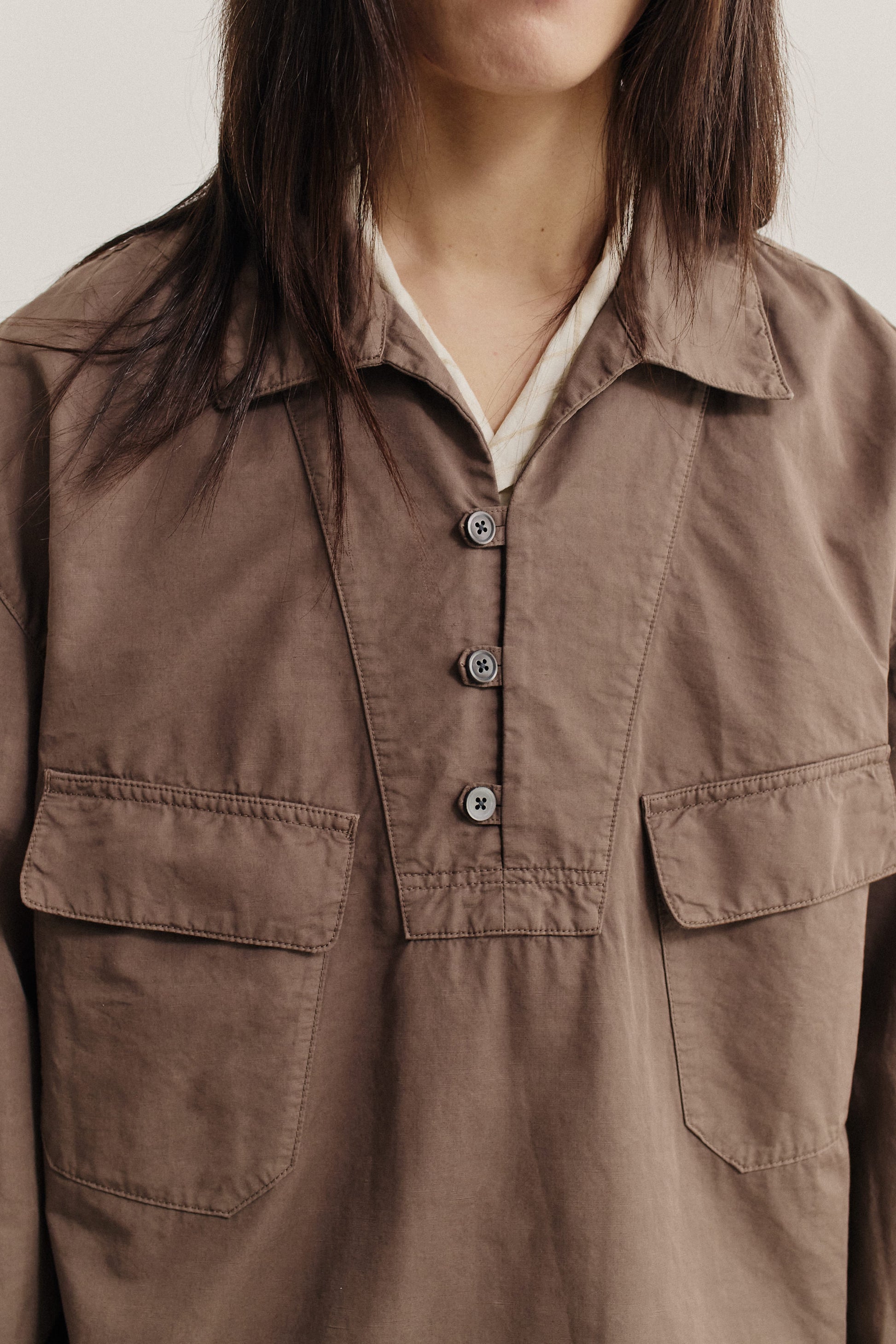 Women's long-sleeved shirt jacket, cotton-linen blend, garment-dyed brown, with polo collar and patch pockets.