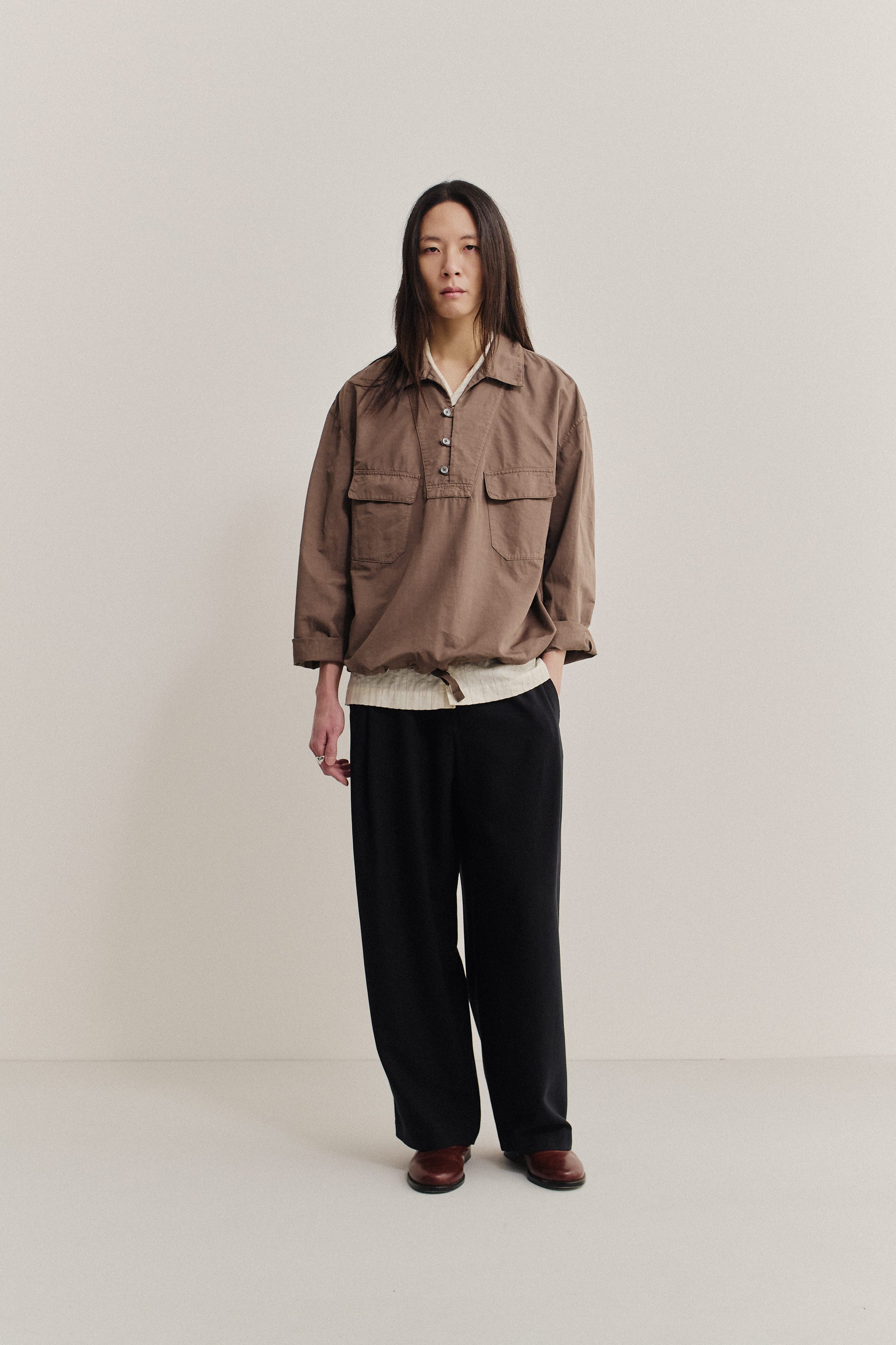 Men's long-sleeved shirt jacket, cotton-linen blend, garment dyed brown, with patch pockets and spread collar.