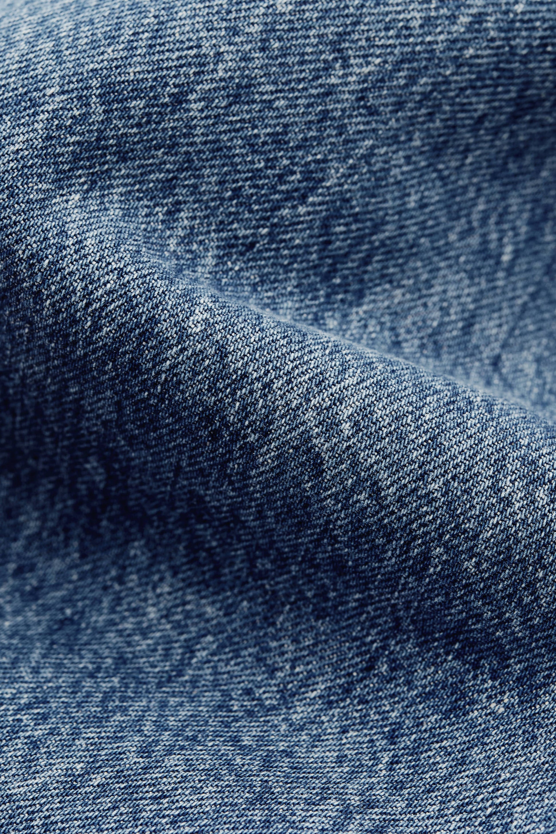 Men's outerwear jacket, washed indigo denim, boxy fit, stand-up collar, patch pockets.