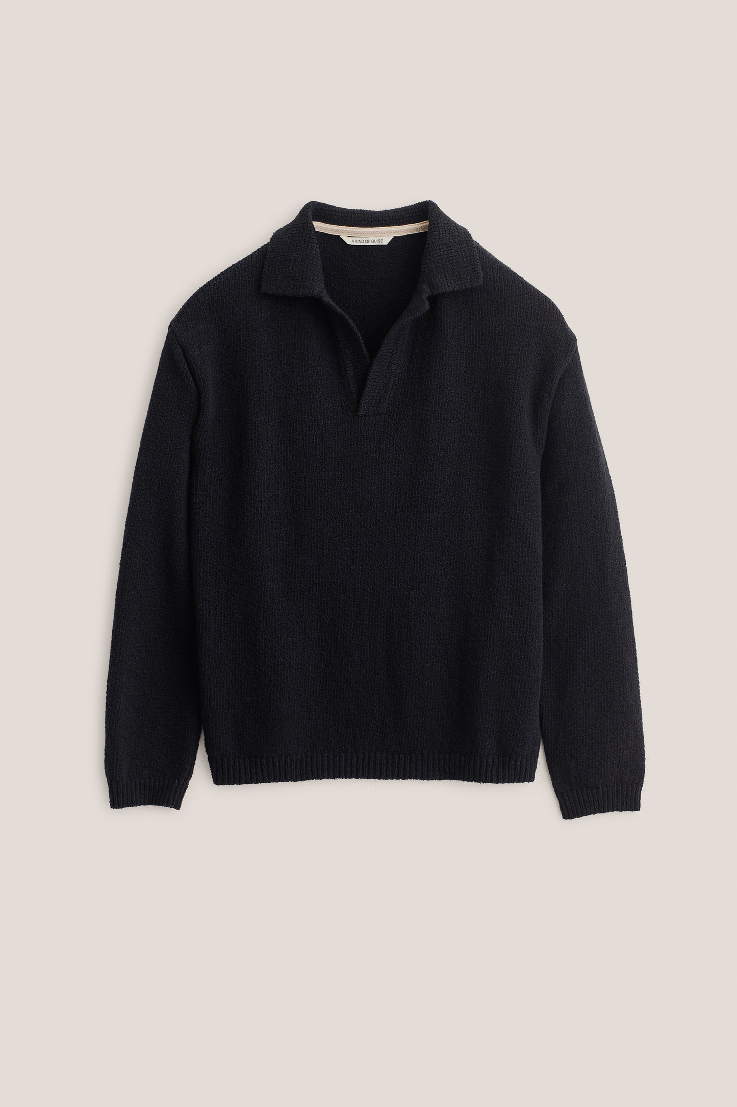 Men's knit polo, long-sleeved, 100% organic cotton bouclé, navy, relaxed fit, open collar.