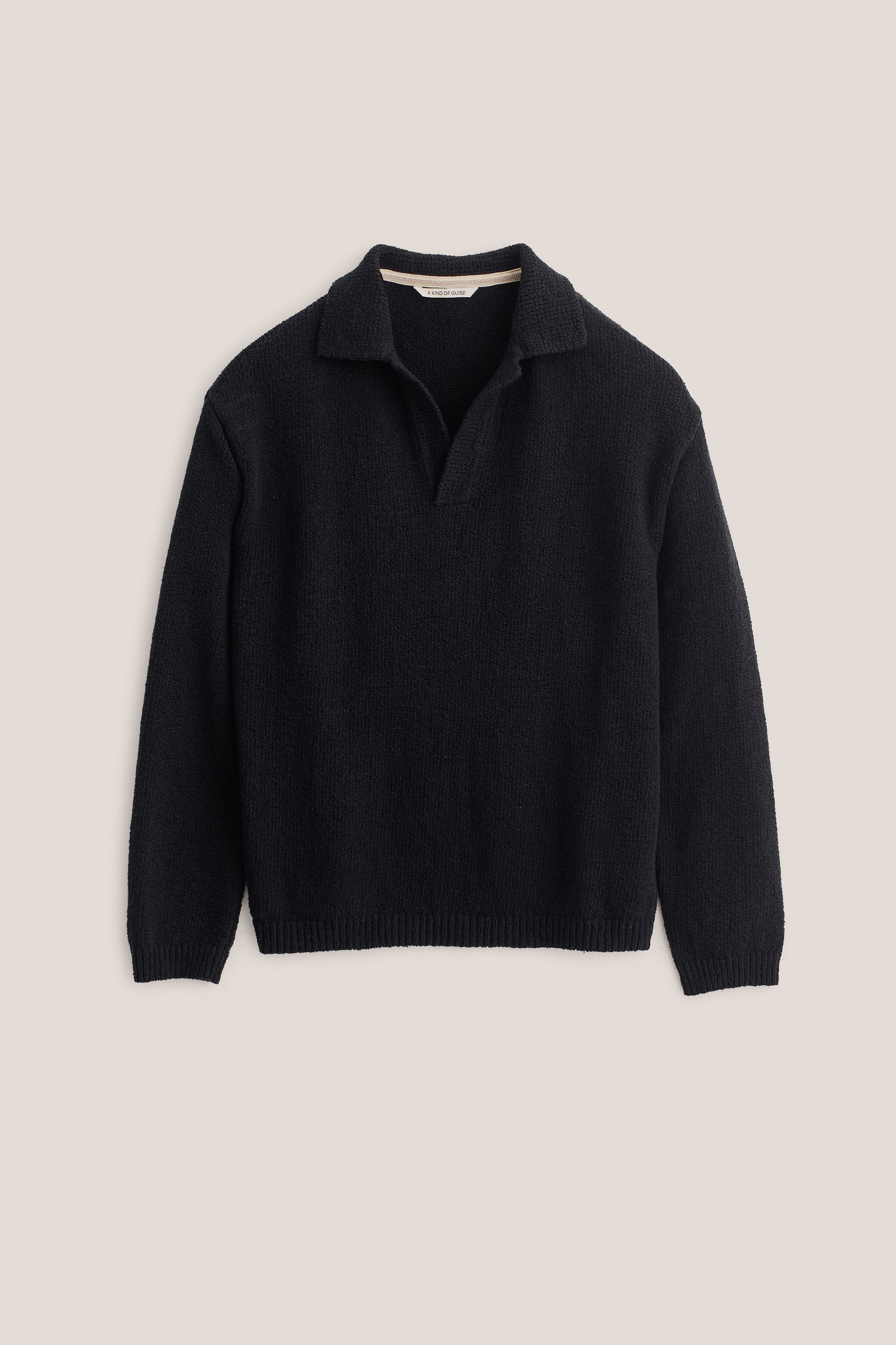 Men's knit polo, long-sleeved, 100% organic cotton bouclé, navy, relaxed fit, open collar.