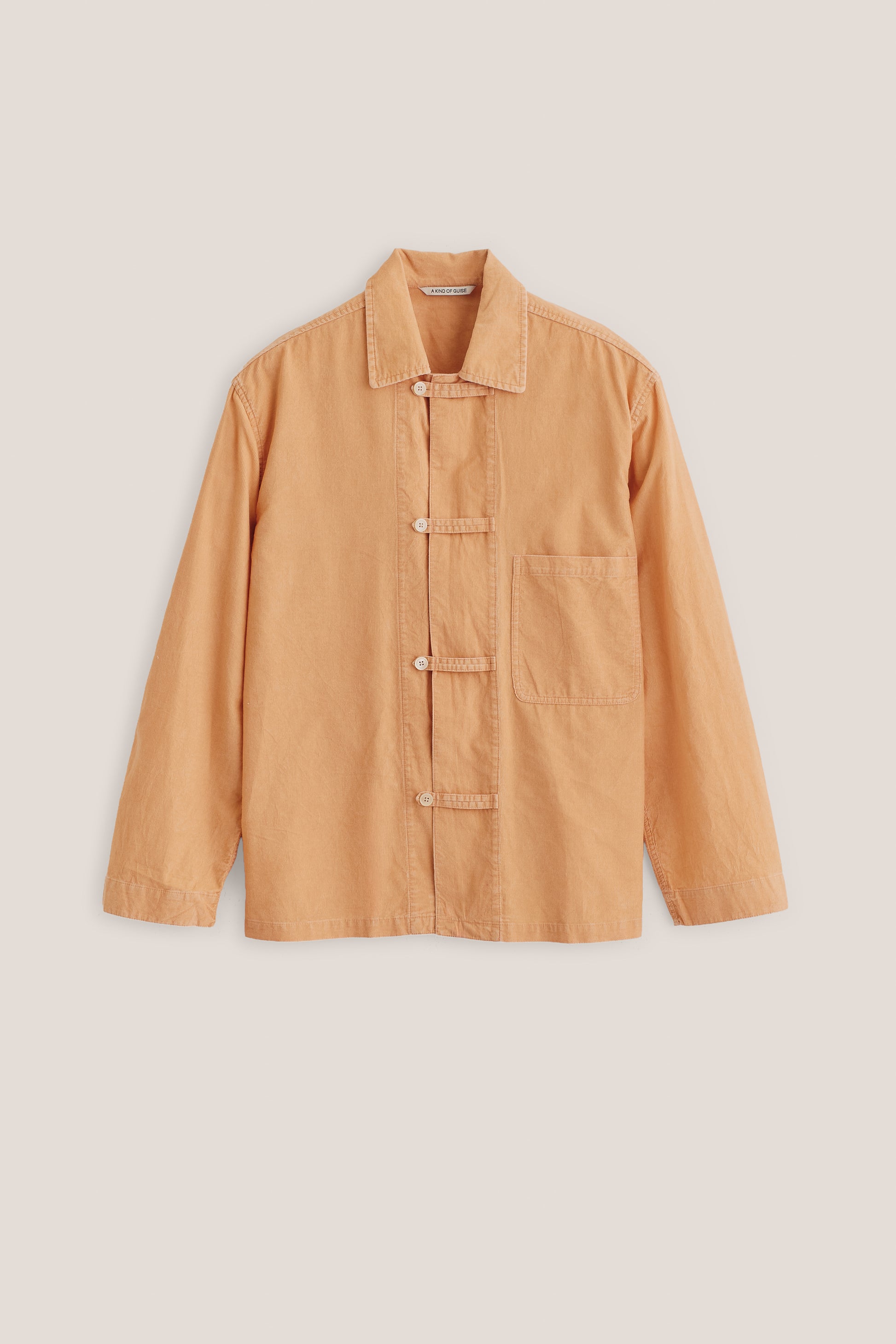 Men's long-sleeved overshirt, 100% cotton light corduroy, garment washed, in a rich peach hue with patch pocket and button fastening.