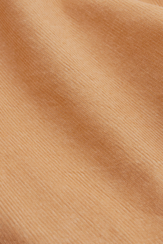 Men's long-sleeved overshirt, 100% cotton light corduroy, garment washed for a vintage feel, in a soft peach hue.