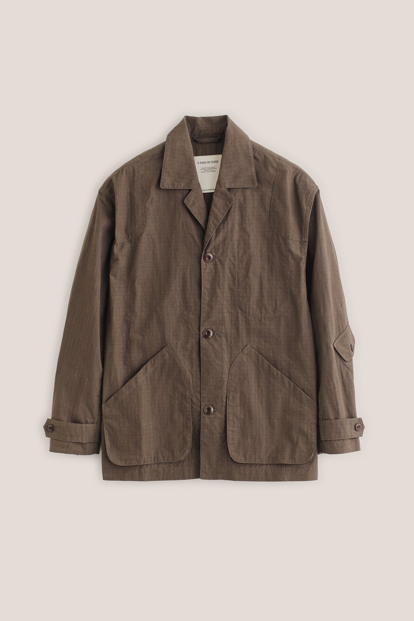 Men's outerwear jacket, brown cotton blend ripstop, vintage-style lapel, patch pockets, corozo buttons.