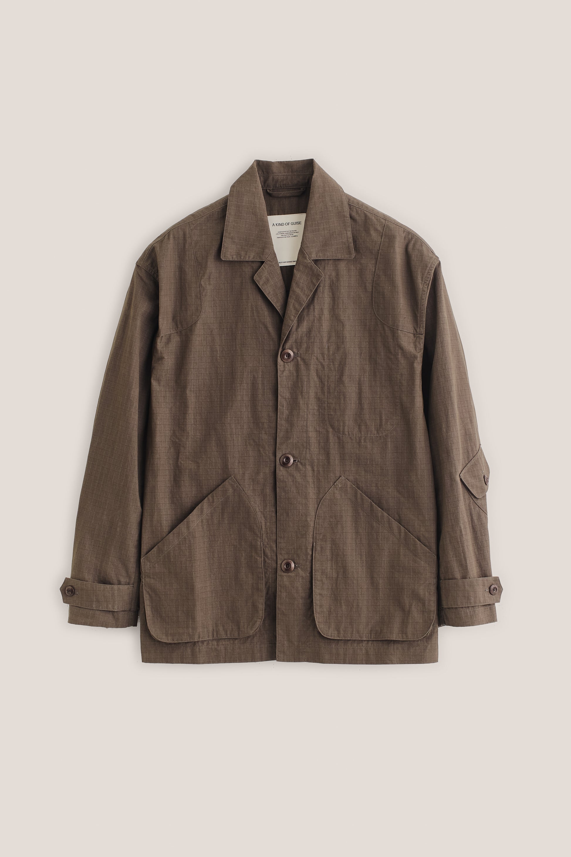 Men's outerwear jacket, brown cotton blend ripstop, vintage-style lapel, patch pockets, corozo buttons.