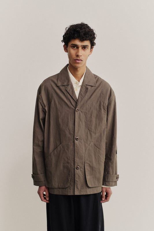 Men's outerwear jacket, cotton blend ripstop, waxed finish, brown, vintage lapel, patch pockets.