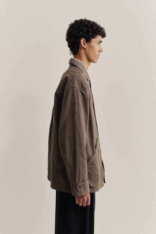 Men's outerwear jacket, cotton blend ripstop, waxed finish, brown, vintage-style lapel, patch pockets.
